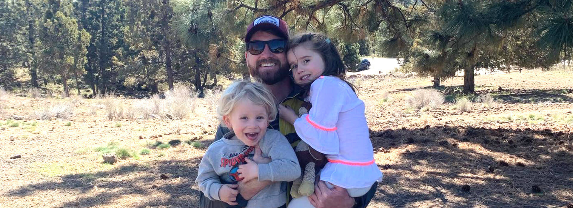 Dad posing with daughters